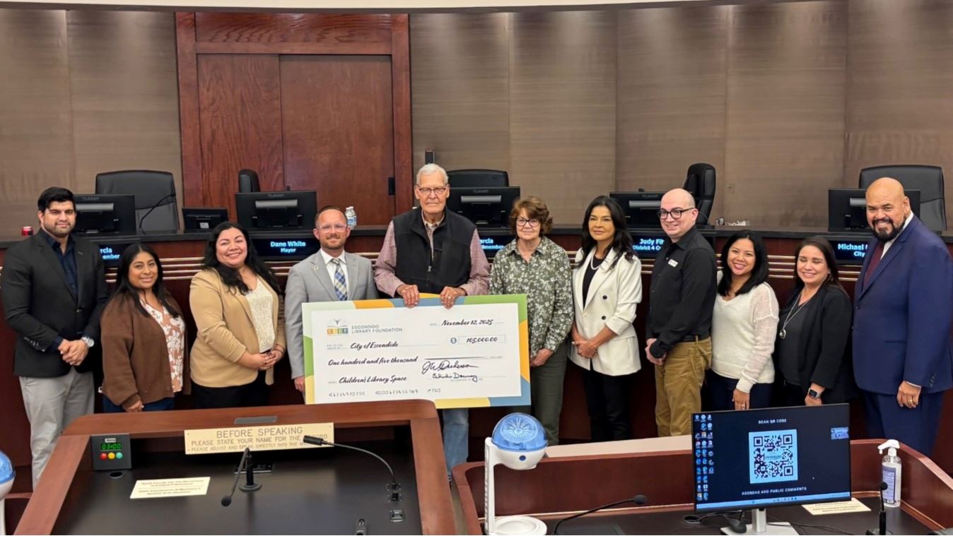 Image of City Council and Foundation holding a large check